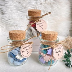 Mini soaps in glass jars with corks
